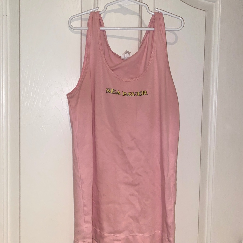 Light pink tank top with boat on the back
